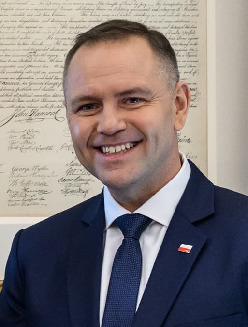 Karol Nawrocki in a dark suit and tie, photographed in 2025.