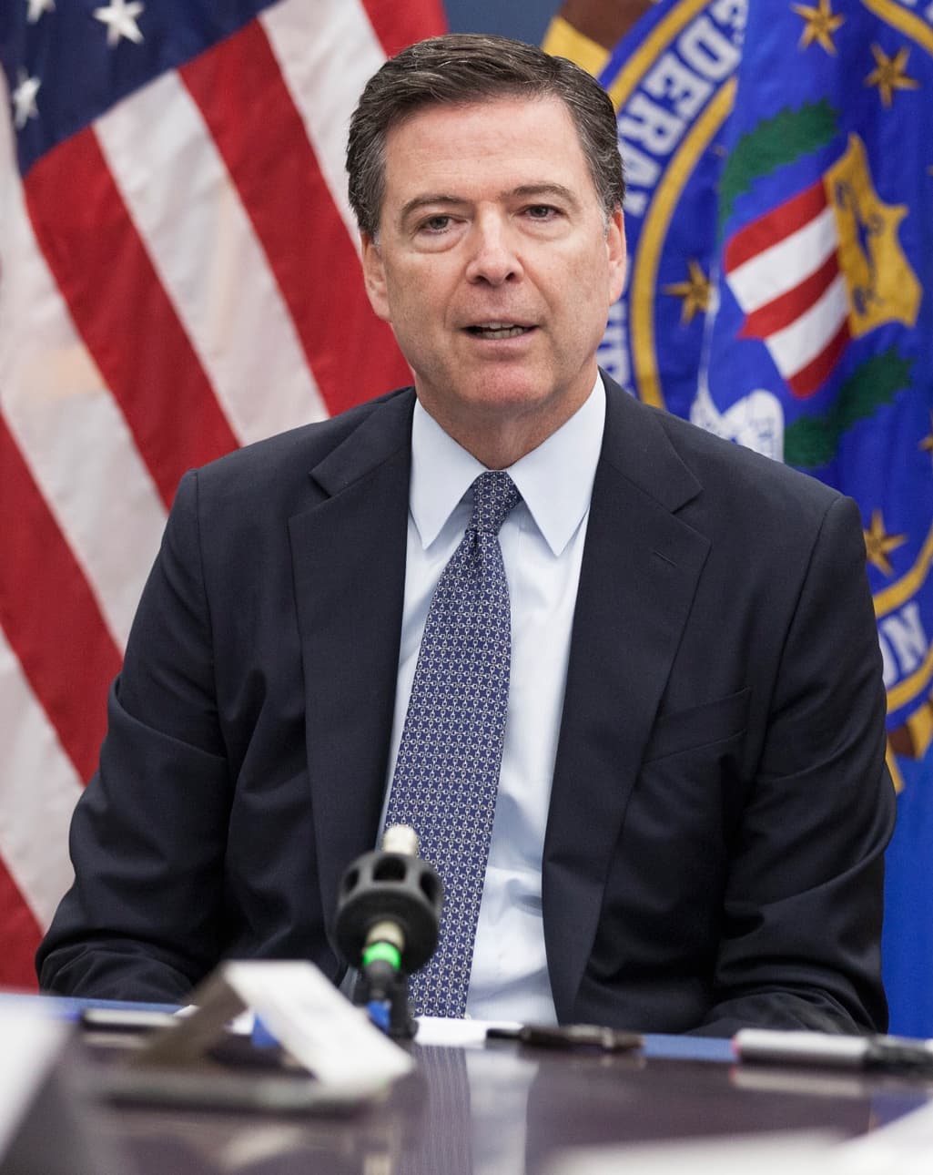 Former FBI director James Comey speaking at a 2016 briefing