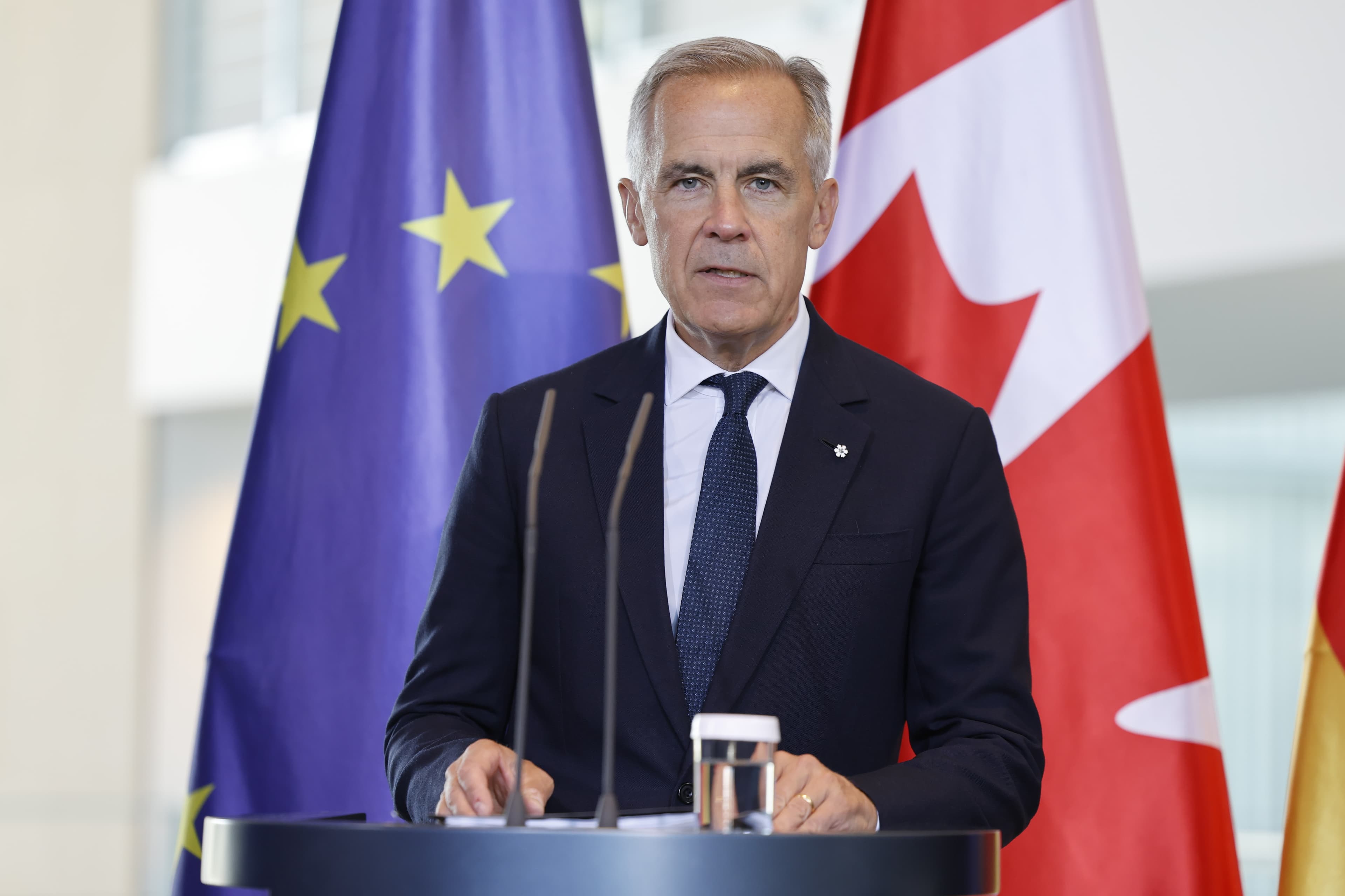 Canadian Prime Minister Mark Carney speaking during a 2025 visit to Berlin