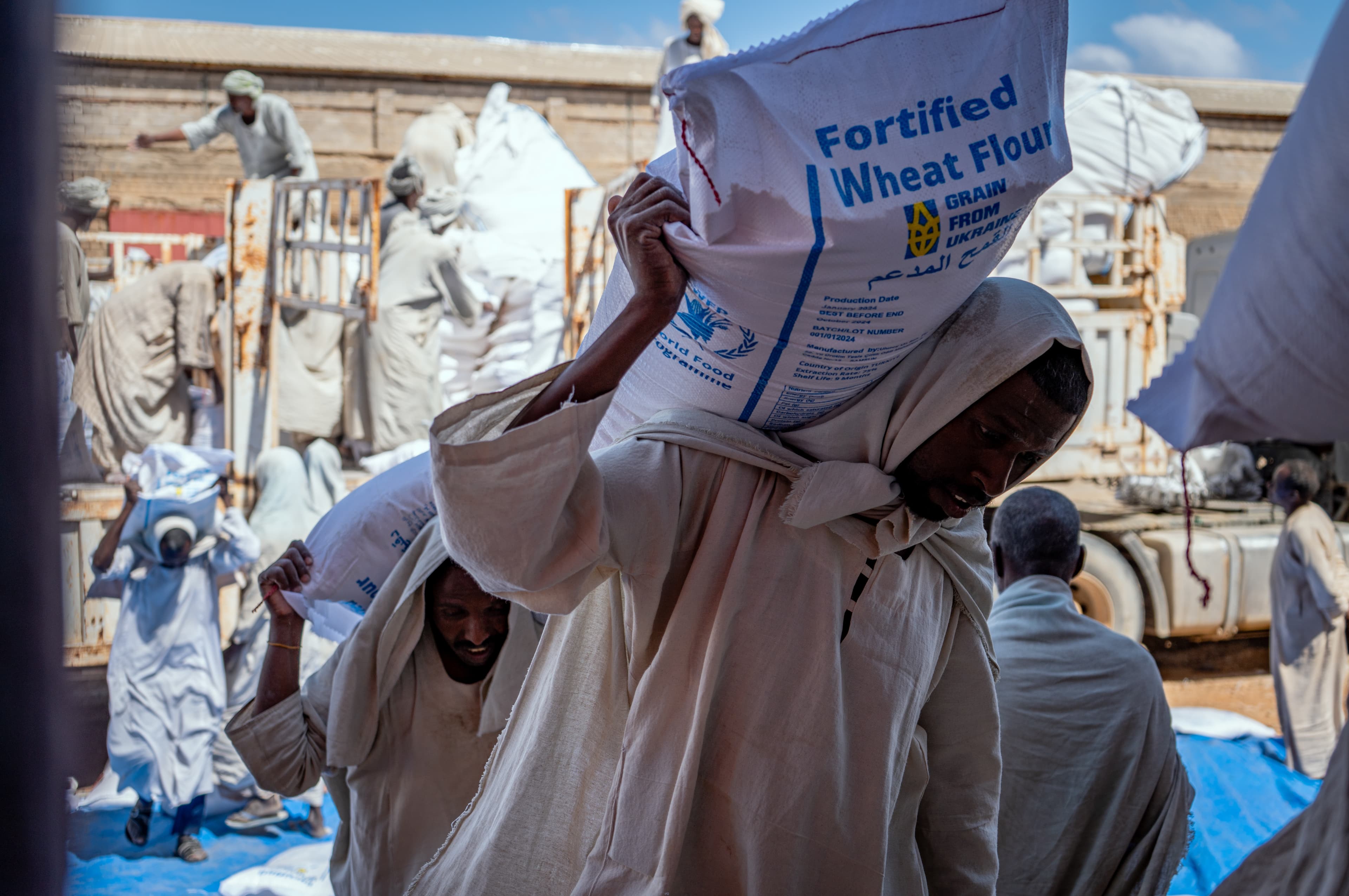 World Food Programme emergency food supplies being loaded onto trucks in Port Sudan in 2024.