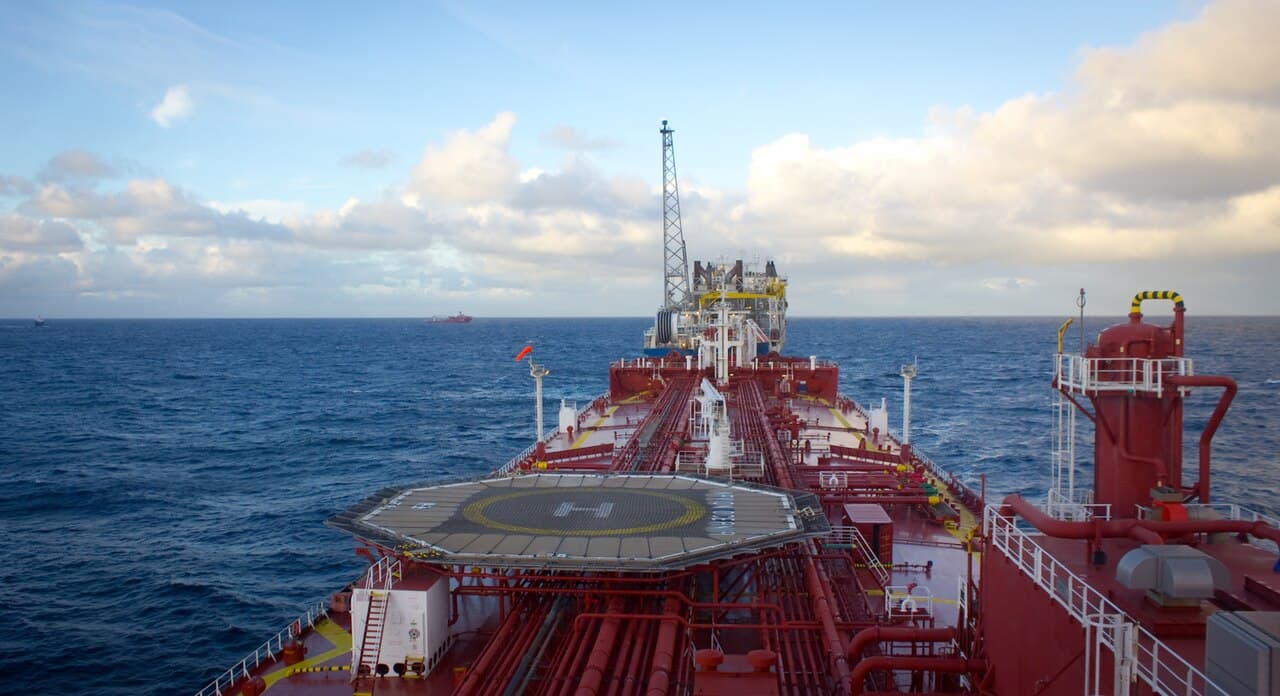 A shuttle tanker approaching the Alvheim FPSO oil production vessel in the North Sea, 2012 (archival)